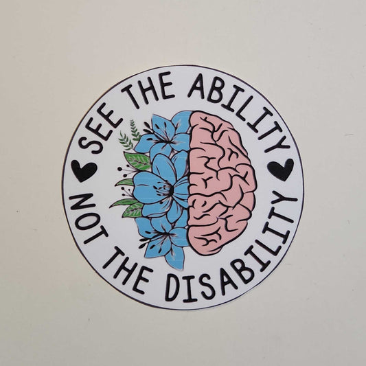 Circular sticker with brain and flowers design on a white background