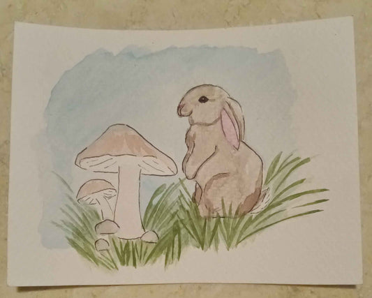Cartoon rabbit and mushroom illustration on a white card with a beige background