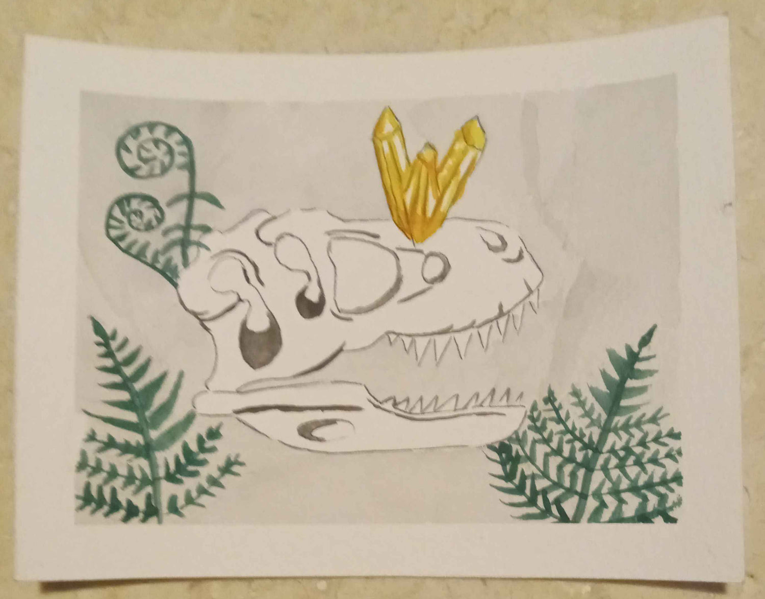 Cartoon Dinosuar with a yellow on a piece of paper against a textured surface