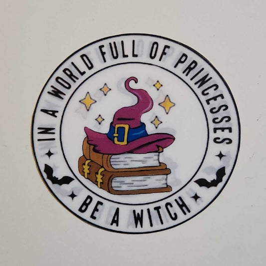 Decorative sticker with a witch hat, books, and text on a white background
