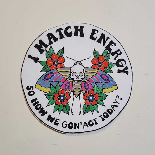 Circular sticker with colorful design and text on a plain background