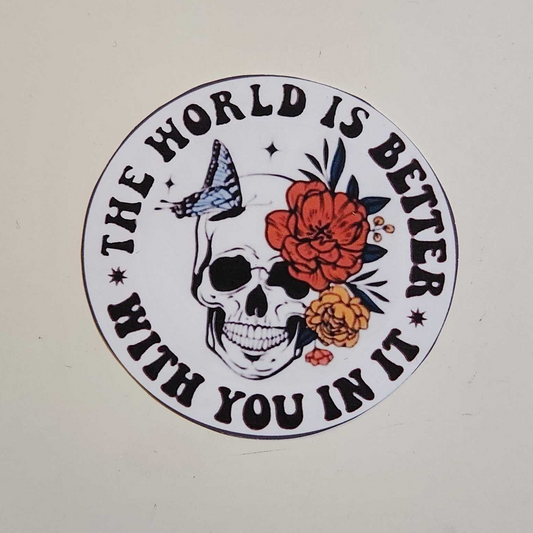 Circular sticker with skull and roses design on a white background