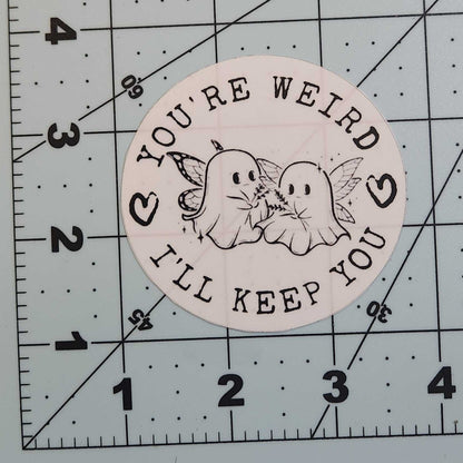 Circular sticker with text and graphics on a grid background