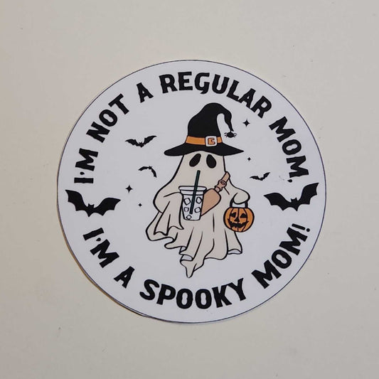Circular sticker with Halloween-themed text and graphics on a white background